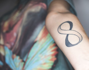 Cassie’s first tattoo was the infinite symbol on her arm, which she says she began thinking about getting as early as her sophomore year of high school.